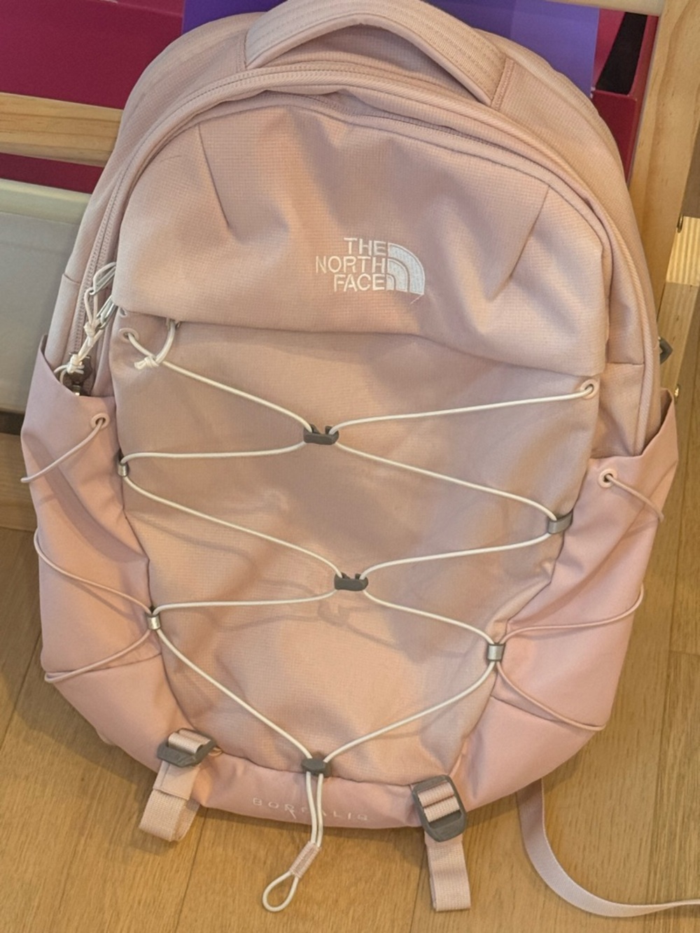 The North Face Light Pink Backpack with White Bungee